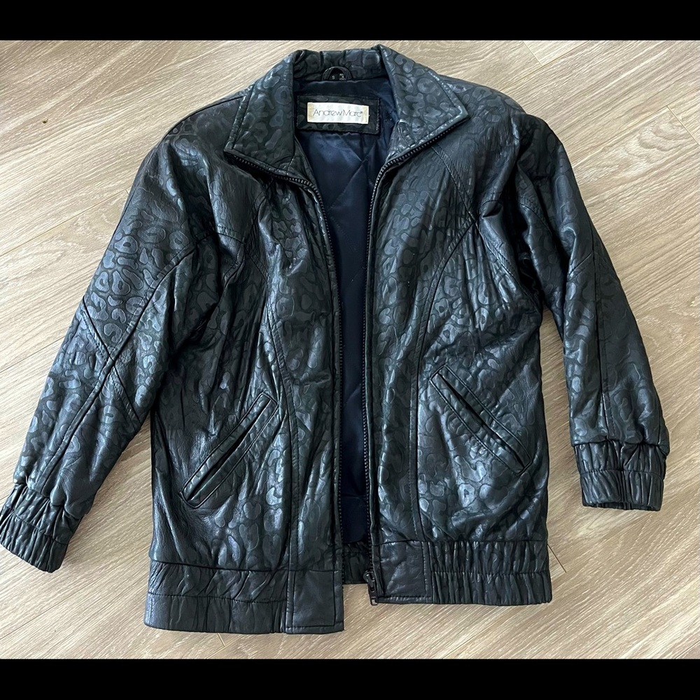 Andrew Marc black leather jacket from Neiman Marcus. Cheetah stamped.